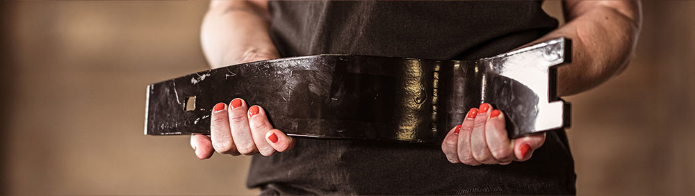 Detailed view of someone holding a Väderstad MixIn shin in their hands