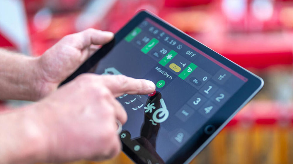 Hand using the iPad-based control system Väderstad E-Control