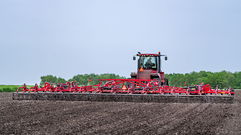 Wil-Rich QX2 field cultivator working on a field