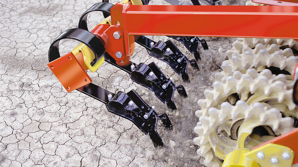 Double knife breaking crust and clods