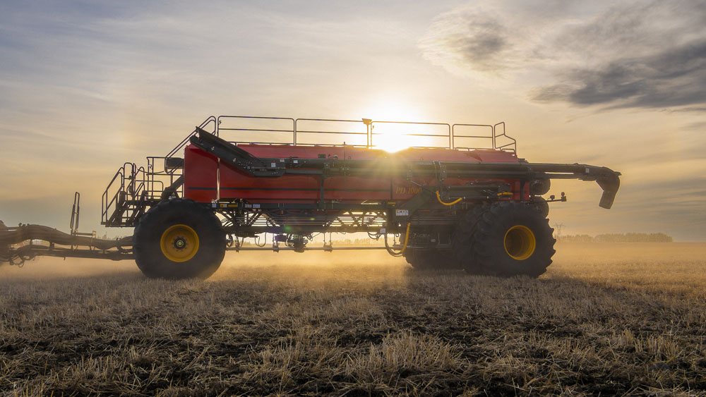 Väderstad Precision Delivery Air Cart 1000 on a field, in the sunset