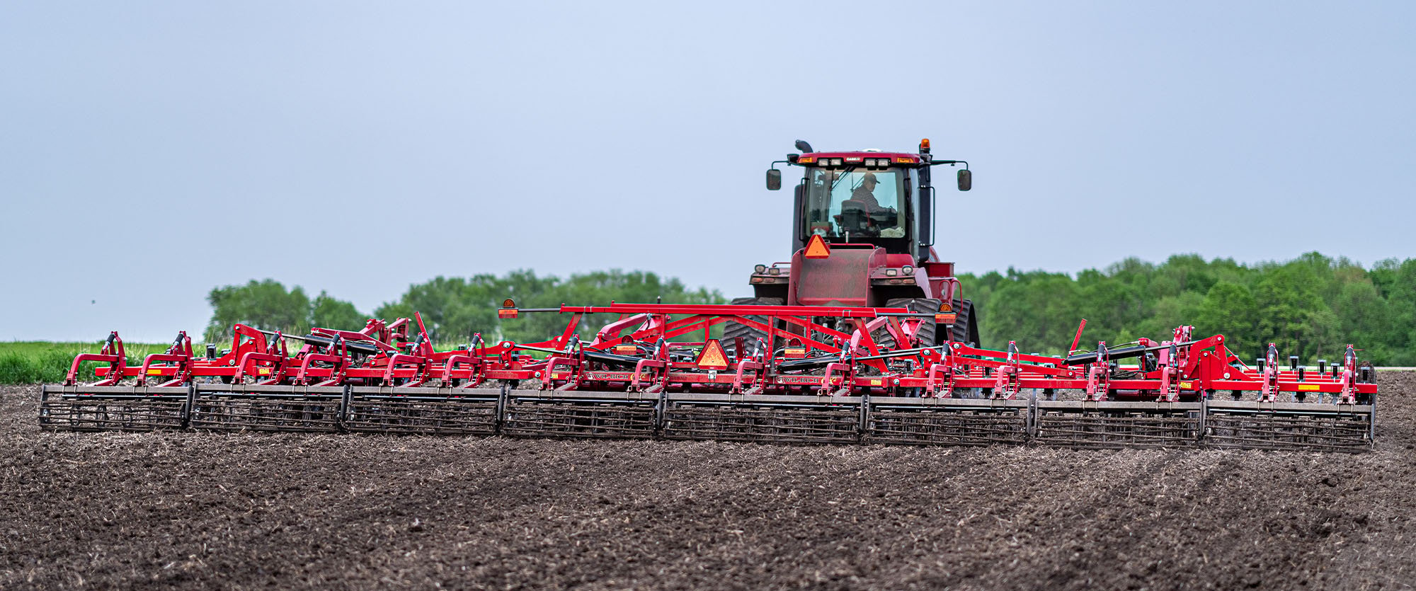 Wil-Rich QX2 field cultivator working on a field