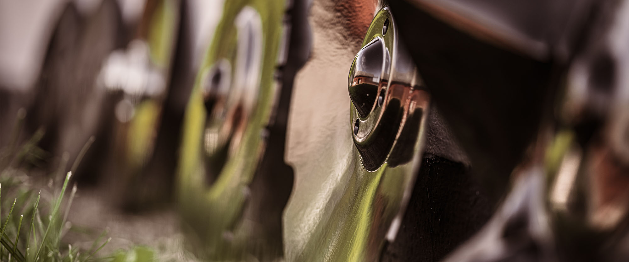 Close-up of someone holding a Väderstad cultivator disc in their hand.