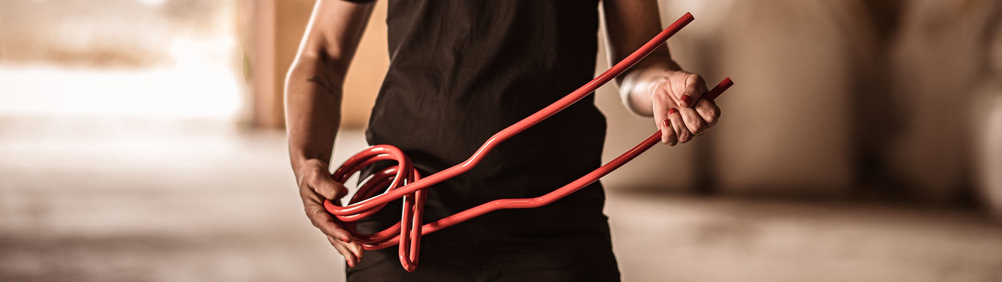 Close-up of someone holding a Väderstad following harrow tine in their hands