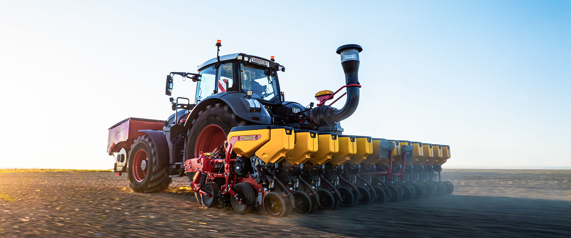 Väderstad Tempo V 12 rows in field during sunrise
