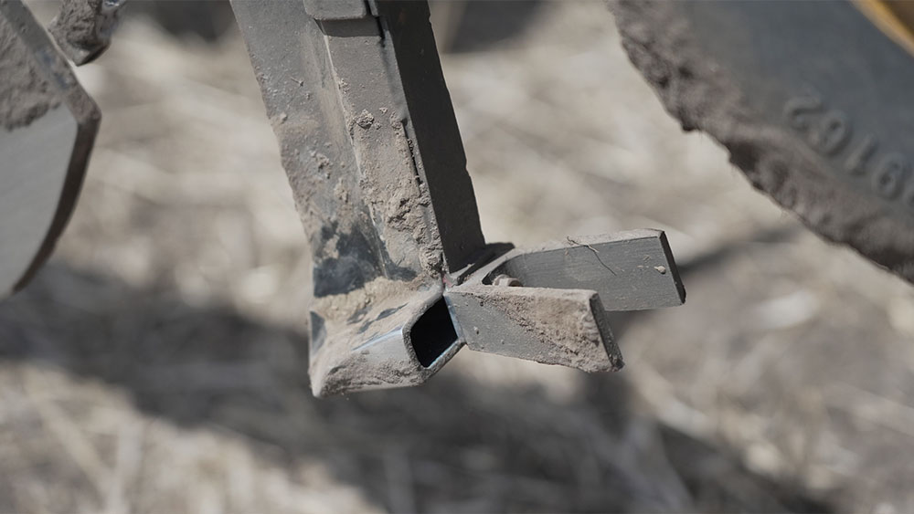 Detail photo of the Seed Hawk coulters in the ground