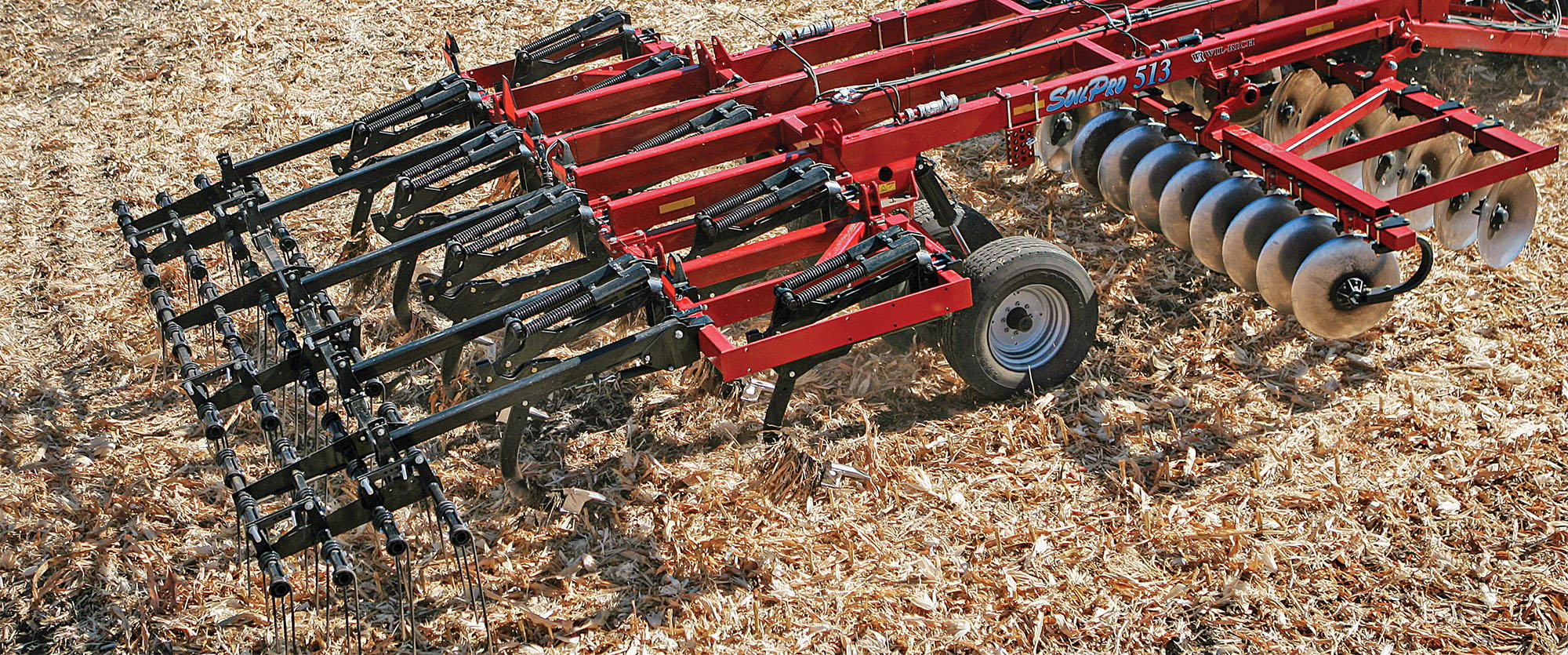 Aerial photo of Wil-Rich SoilPro 513 working on a field