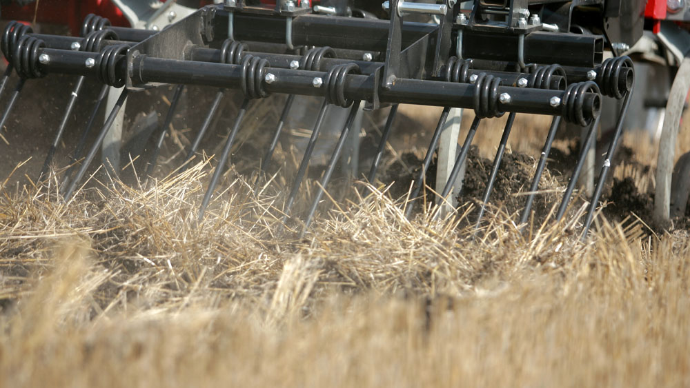Close-up of the harrow on a Wil-Rich 2500 Chisel Plow working the field
